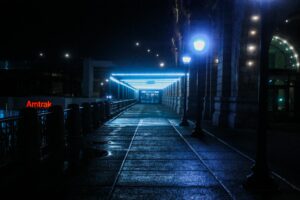 black outdoor pedestal lamp near coaster train rail