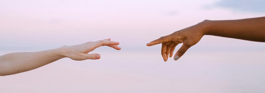 photo of people reaching each other s hands